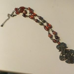 Ornate Designed center Pendent in Browns and metal